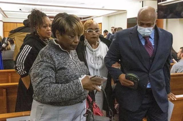 Manny Ellis’s mother, Marcia Carter-Patterson, second from right, is escorted out of court after the jury's verdict was delivered