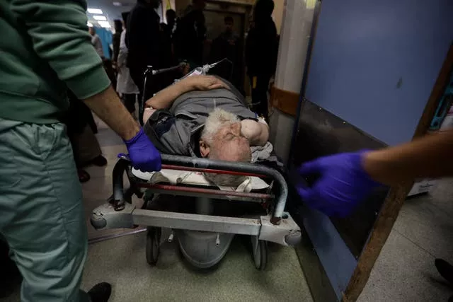 Palestinians wounded in Israeli air strikes arrive at the Nasser hospital in the town of Khan Younis
