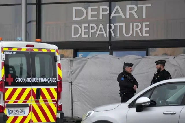 Gendarmes guard the closed entrance of the Vary airport in Vatry, eastern France