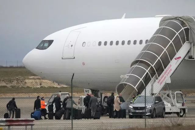 Crew members board the plane grounded by police at the Vatry airport in Vatry, eastern France 