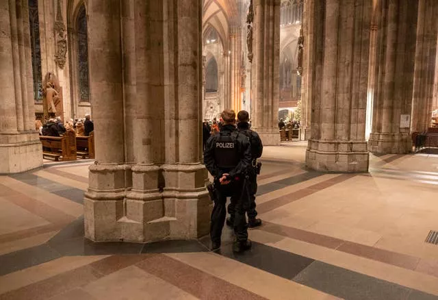 Police officers in Cologne Cathedral during the end-of-year pontifical mass on New Year's Eve