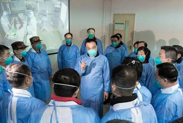 Then-Chinese premier Li Keqiang, centre, speaks to medical workers at Wuhan Jinyintan Hospital in Wuhan in central China’s Hubei province on January 27 2020
