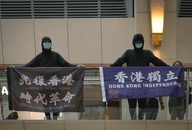 Protesters hold banners in Hong Kong 