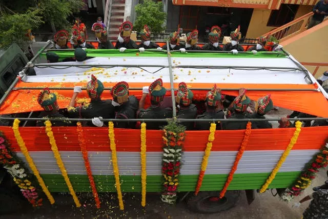 A coffin with an Indian flag