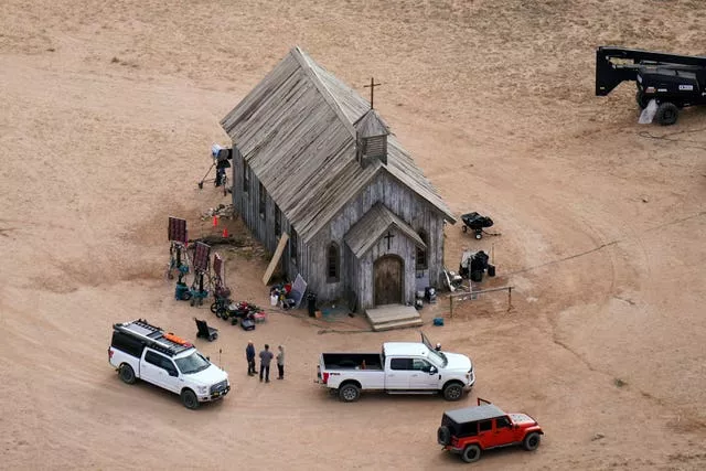 Aerial photograph of the Rust film set showing a building and cars