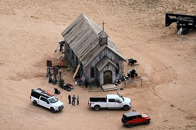 Aerial photograph of the Rust film set showing a building and cars