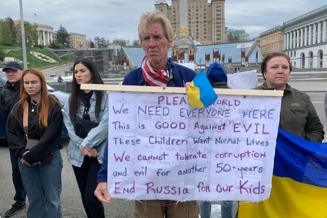 Ryan Wesley Routh holds up a banner during a rally in central Kyiv, Ukraine, on April 30 2022