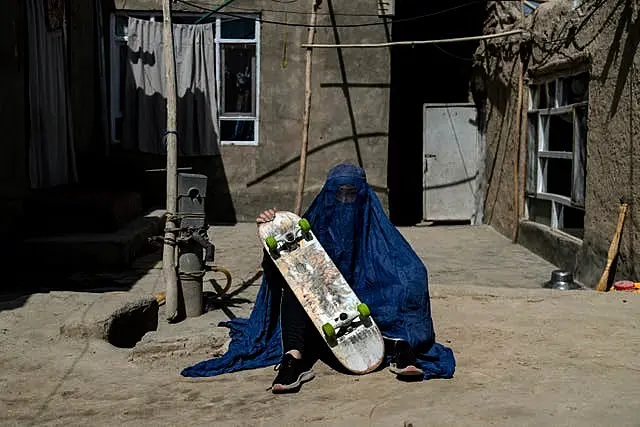 Afghan girl with skateboard