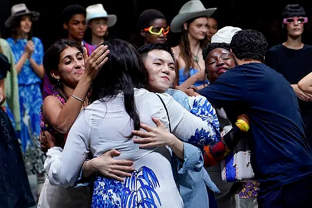 The We Are Made in Italy (Wami) collective celebrate on stage at the end of the Stella Jean women’s spring-summer 2023 collection presented in Milan in September 