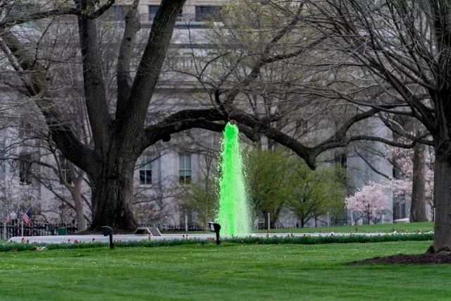 The fountain on the North Lawn of the White House is dyed green for St Patrick’s Day 