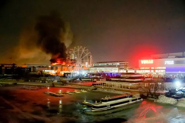 A massive blaze is seen over the Crocus City Hall on the western edge of Moscow, Russia