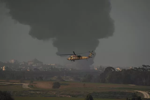 An Israeli military helicopter flies near the Israeli-Gaza border on Monday