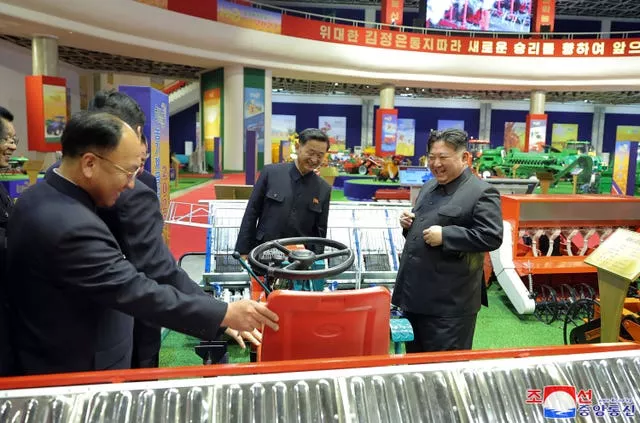 Kim Jong Un, centre, inspects an agricultural machinery exhibition in Pyongyang, North Korea, on Tuesday