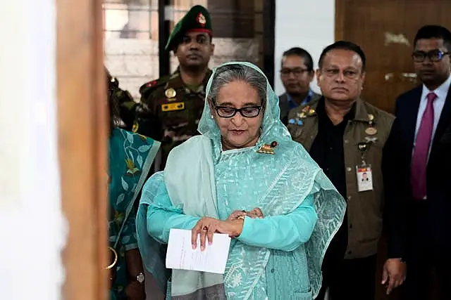 Sheikh Hasina checking her watch