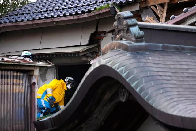 A rescuer on a temple roof