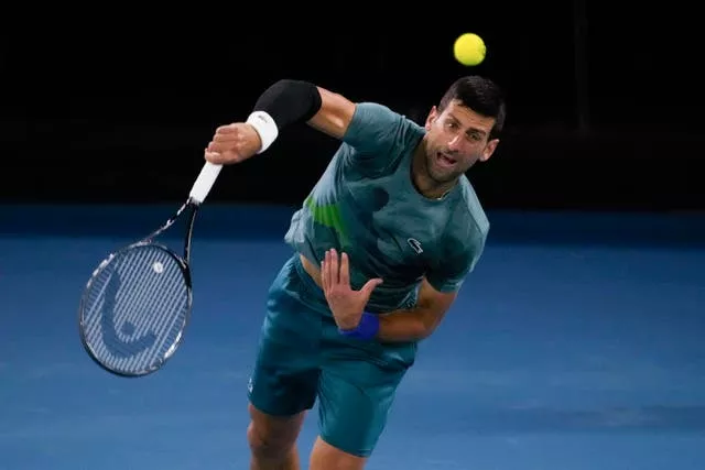 Novak Djokovic serves during a practice session at Melbourne Park