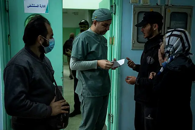 Dr Suhaib Alhamss speaks with patients at the hospital