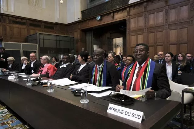 Ambassador of the Republic of South Africa to the Netherlands Vusimuzi Madonsela, right, and minister of justice and correctional services of South Africa Ronald Lamola, centre, during the opening of the hearings at the International Court of Justice in The Hague, Netherlands