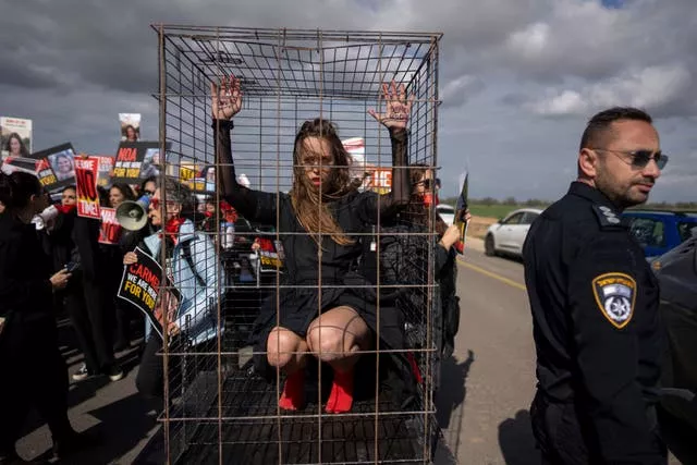Relatives and supporters of the Israeli hostages held in the Gaza Strip by the Hamas militant group attend a march calling for their release near Kibbutz Urim, southern Israel 