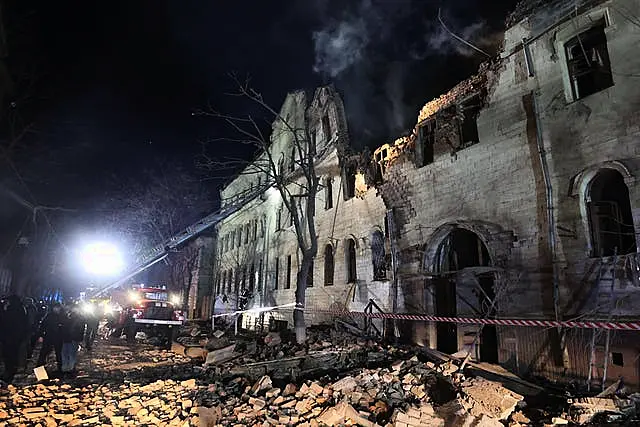 An apartment building damaged in a Russian rocket attack is seen in Kharkiv, Ukraine, in the early hours of Wednesday