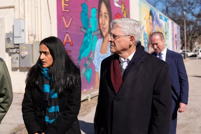 Attorney general Merrick Garland, right, and associate attorney general Vanita Gupta, left, tour murals of shooting victims in Uvalde, Texas