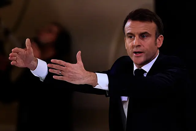 French President Emmanuel Macron gestures during the press conference