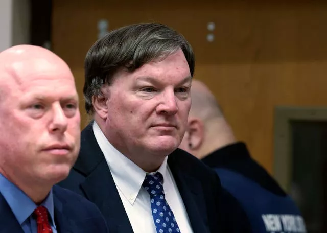 Rex Heuerman, right, listens in court on Tuesday 