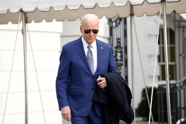 President Joe Biden walks to speak to the media before boarding Marine One on the South Lawn of the White House in Washington