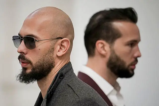 Andrew Tate, left, and his brother Tristan inside the Court of Appeals building in Bucharest, Romania, in January