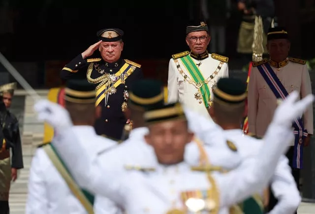 Sultan Ibrahim Sultan Iskandar salutes the guard of honour