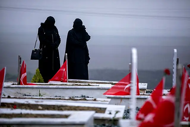 People in a cemetery