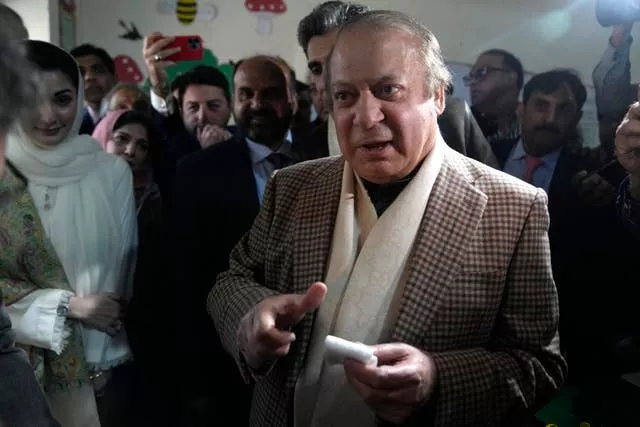Pakistan’s former prime minister Nawaz Sharif arrives to cast his vote at a polling station for the country’s parliamentary elections, in Lahore, Pakistan