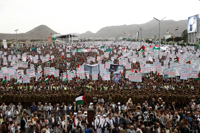 Houthi supporters attend a rally against the US-led strikes against Yemen and in the support of Palestinians in the Gaza Strip, in Sanaa, Yemen, on Friday