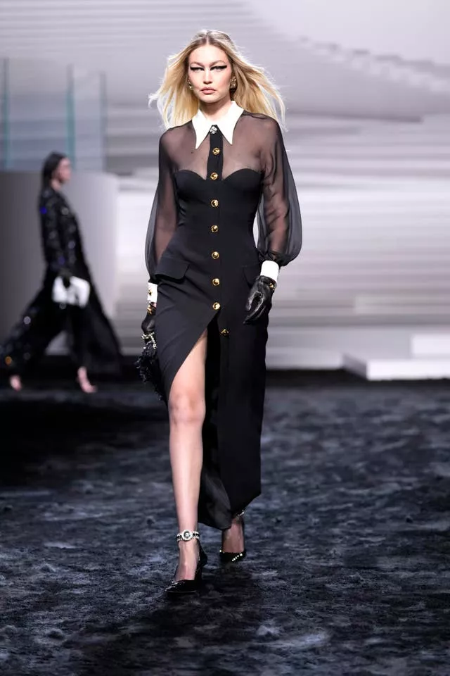 Gigi Hadid Wears Sheer Corseted Dress While Walking in Versace