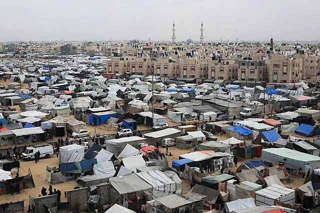 A tent camp housing Palestinians displaced by the Israeli offensive in Rafah (Hatem Ali/AP) Israel Palestinians Six Months Photo Gallery
