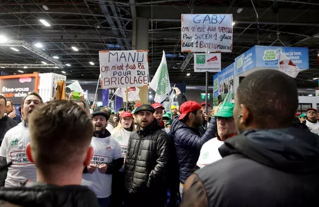 Farmers protest at the agriculture fair in Paris 