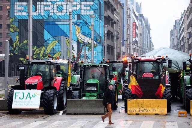 Tractors parked behind a blockade during a protest in Brussels