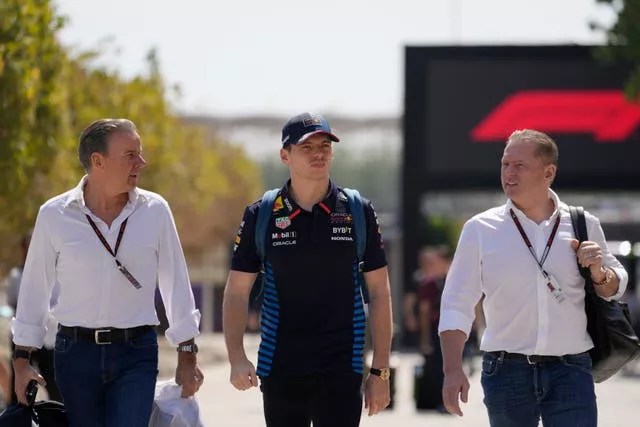 Max Verstappen (centre) walks with his manager Raymond Vermeulen (left) and father Jos Verstappen (right) at the Bahrain Grand Prix