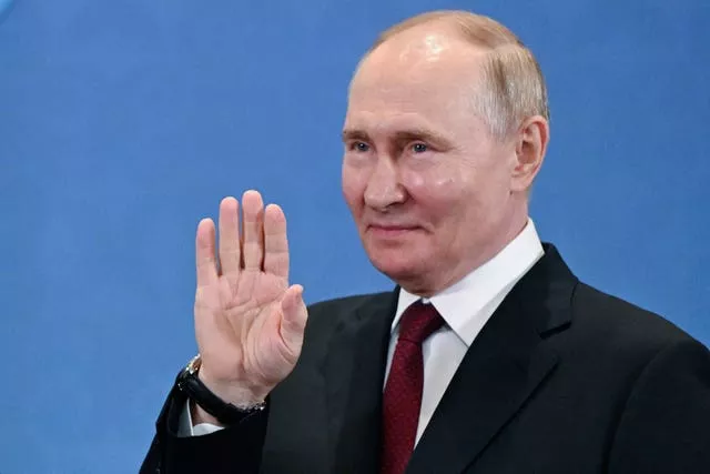 Russian President Vladimir Putin gestures 
