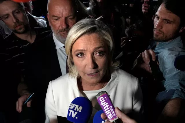 Marine Le Pen speaks to reporters 