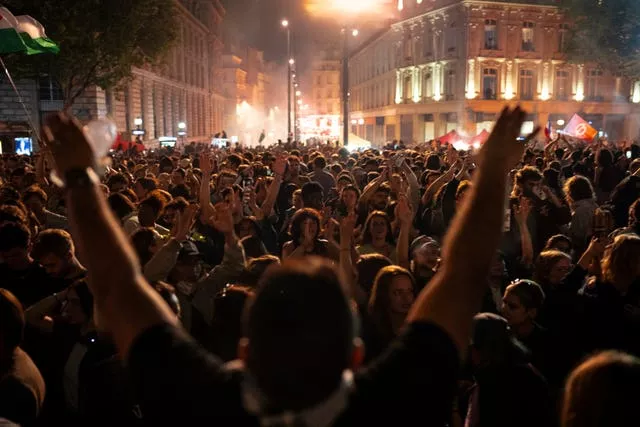 People gather at the Republique plaza after the second round of voting