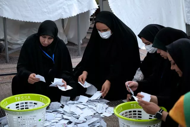 Election officials count ballots