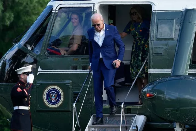 Biden departs a helicopter