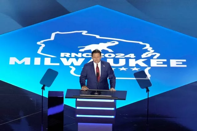 Ron DeSantis stands behind a lectern at the RNC