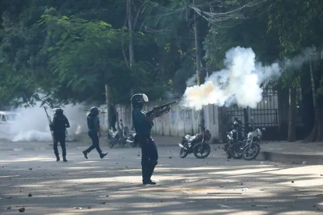 Police fire tear gas shells and rubber bullets to disperse students at the university campus in Dhaka