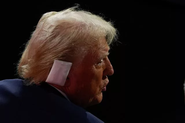 Donald Trump with a bandage on his right ear