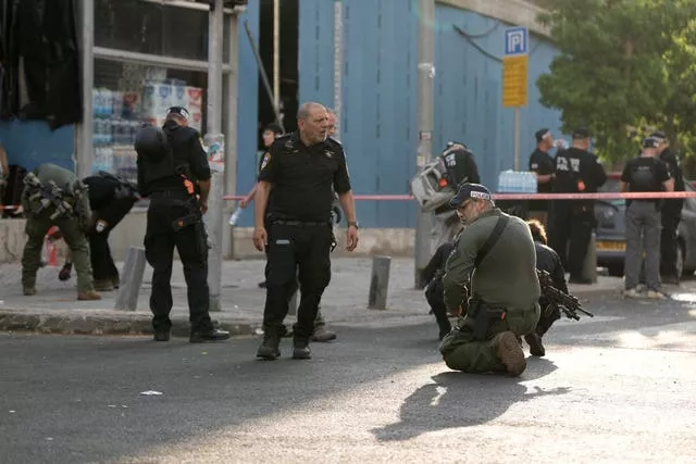 Israeli police investigate the scene of a deadly explosion in Tel Aviv