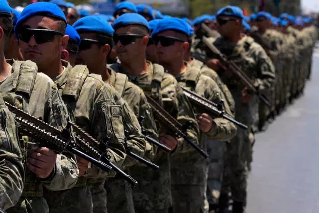 Turkish soldiers take part in a military parade