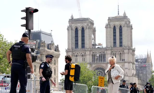 Police with Notre Dame in the background