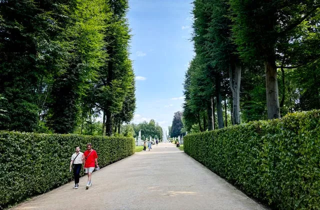 People walk down a path in Sanssouci Park